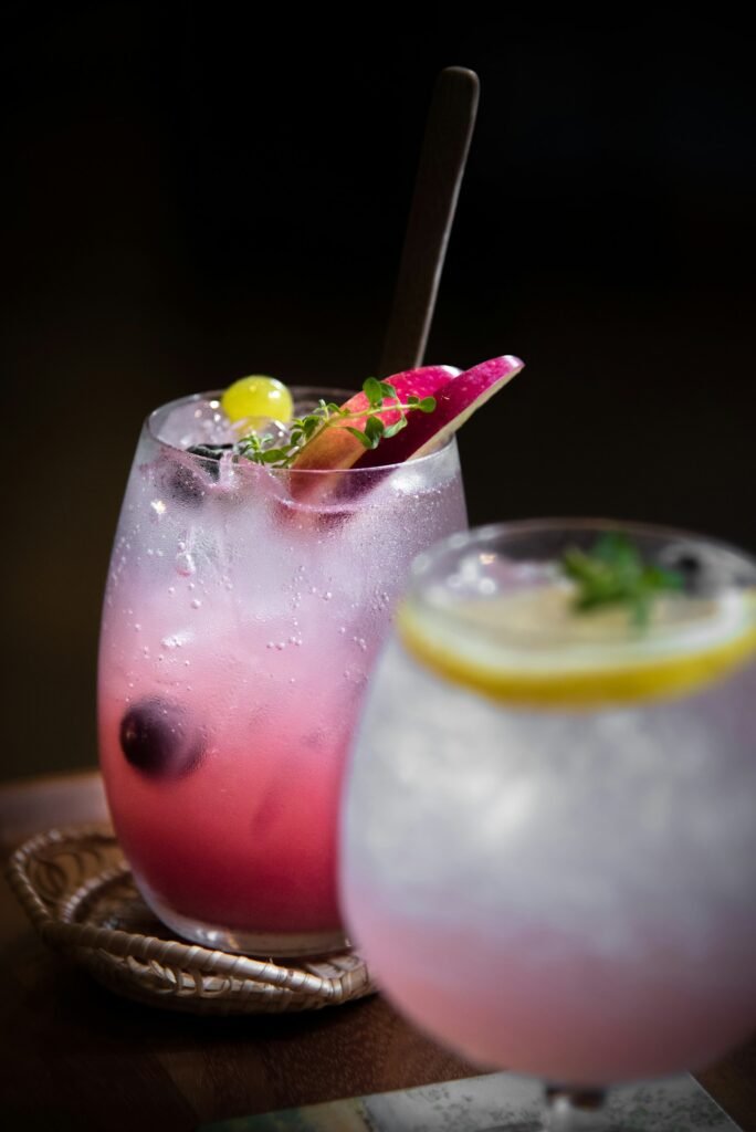 Pink sparkling drink with ice