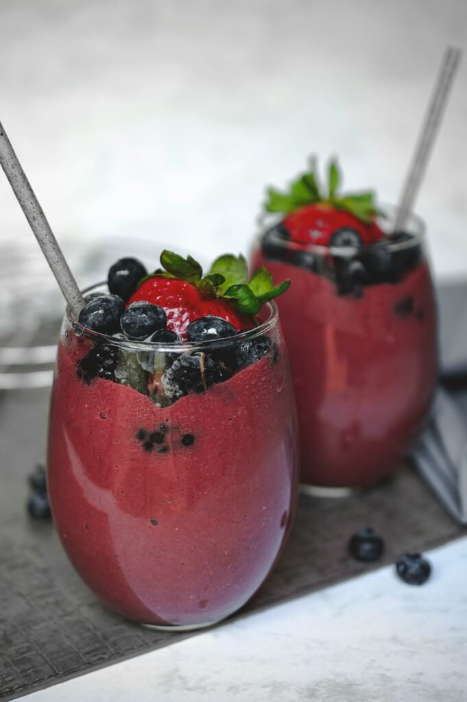 Two fruit smoothies in glasses